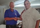 Preston Crow congratulated by his son-in-law Rob Goodin, the former Olney Police Chief. Photo by Gina Keating
