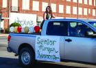 OHS Homecoming Queen nominee Bradi Bowers waves to parade attendees. Photo by Will Sadler