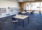 New white shelving, carpet and furniture give the library’s main room a clean, bring look. Photo by Will Sadler