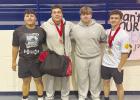 Two OHS Cub Powerlifters competed well enough in the regionals in Decatur to qualify for the state contest. Those Cubs headed to state are Maddox Johnson [far right], who also beat the regional bench press record in his class, and Jacobi Esquivel. The ent