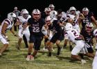 Cub #22 Kyle Stewart blocks and leads the way for #5 Kanton Rodgers DE-RB who runs for yardage, the Cubs saw little success offensively against the Bearcats but the success that came was mainly from the Cubs running game and QB #11 Tucker Cortinez’s scr