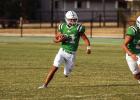 A Bobcat running back looks downfield for his opening toward the goal. Photo by Will Sadler