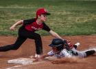 Olney Cub #10 Brayson Betts tags an opponent out at third base. Photo by Will Sadler