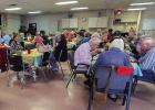 The Cub Center offers delicious holiday meals which include festive fellowship around holidays which may be the only celebration of the holiday some enjoy with others. Shown are community members enjoying a Thanksgiving lunch. Photo by Will Sadler