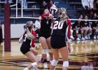 Lady Cub #4 Mackenzie Berngen saves a kill and sends a volley over the net to Lady Panther defenders. Photo by Will Sadler