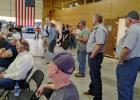 County Commissioners Jimmy Wiley and Scott Shook (standing on right) and Alan Craig and Stacy Creswell (sitting on left) listen as Young County residents question solar farm reps at the Eliasville-South Bend Volunteer Fire Department on Nov. 5. The projec