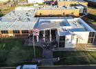 Olney Junior High students wait for the first bell outside the school. Photo by Will Sadler