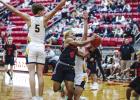 OHS Cub #4 Jamarcus Collins, Olney Enterprise Player of the Game, shown crashing through Lobos defense as he did all night. Collins would not be denied a big night for the Cubs. Photo by Will Sadler