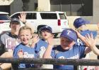 The Rangers Little League team greets well-wishers during the Little League parade on Saturday, opening the 2026 season. Photo by Kelsey Belyeu
