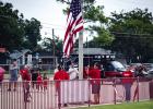 Olney American Legion Post 414 hoist the colors before as the OHS POOHS perform the National Anthem at the Cubs vs Pirates game. Photo by Will Sadler