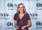 School board president Summer Branum shows off her award for Citizen of the Year at the Olney Chamber banquet. Photo by Will Sadler