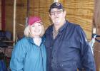 Tami and Jeff Harvey pause for a photo in between coordinating volunteers and delivering meals to curb side donators. The fundraiser included a drink, BBQ sandwich, chips and cookie for $10. Photo by Will Sadler