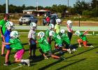 Bobcat practice began for the smaller Cats as well. The little league took the field to begin preparations for a successful season, and part of that success will count on great tackle technique. Bobcats are shown running tackles and blocking drills before