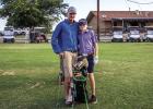 Dusty McElroy proudly poses for a photo op with son Christopher. Photo by Will Sadler