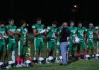 NHS Head Football Coach and Athletic Director Isaiah Archer addresses the Bobcats with last minute instructions before the district matchup with the Vernon Indians. Photo by Will Sadler