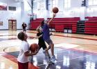 Cubs enjoyed fun competition during the basketball summer camp, shown practicing a layu Photo by Will Sadler
