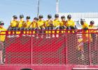 The Orioles wave to spectators from a fire truck during the Little League parade on Saturday. Photo by Hallie Mankins