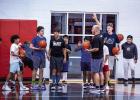 OHS Cub Head Basketball Coach Eric Symank instructs young basketball camp attendees on the rules of one of many skill building games for the day. Photo by Will Sadler