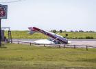 High winds on Sunday, July 5 caused major damage at the Olney Municipal Airport, flipping this private plane. Photo by Will Sadler