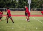 Olney Varsity Cubs Football players line up to run a play against the Munday Varsity during a recent 7-on-7 touch football game. Photo by Will Sadler