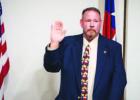 Olney’s new police chief, Bryan Barrett, took his oath of office before the Olney City Council at its Nov. 24 meeting. Photo by Will Sadler