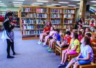 This summer OCLAC has been packed with eager children who enjoyed magic, storytellers and exotic animals as part of the many exciting summer programs this summer. Here Ms. Maria entertains children with a fun and lively story. Photo by Will Sadler