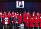 The 42 members of the Olney High School Class of 2026 crossed the stage at the OHS auditorium on Friday, May 15 to claim their diplomas after a week of traditions marking the event. The class is joined by (at left) OHS Principal Haylee Haralson, OISD Supe
