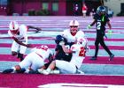 Cub #52 Jacobi Esquivel and #22 Kyle Stewart team up to take down an Eagle runner. Photo by Will Sadler