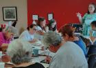 Social worker Mona Bernhardt of Olney leads a lively seminar on color therapy as participants discussed their favorite colors and how - and whether - to stay within the lines. Photo by Gina Keating