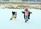 Right: Ainsley with her dog Juni