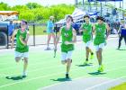 NHS Track Coal Mine Relays Bobcats warm up and practice before starting the 4x4 at the Coal Mine Relays. Photo by Will Sadler