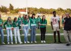 Coach Ryan Dollar addresses the cross-country team, giving words of encouragement and advice. Photo by Will Sadler