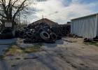 Gas station tire clean-up waits on tire cutter