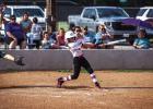 Lady Cub batter swings for the fences and comes away with a double. Photo by Will Sadler