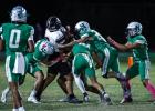 Bobcat defenders swarm a Vernon Indian during the district round. The Bobcat defense kept the Indians to 8 points before the game was called for severe weather leaving the Bobcats with a 46-8 win. Photo by Will Sadler