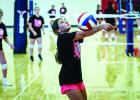 A JV Ladycat returns a volley during summer volleyball in Graham. Photo by Will Sadler