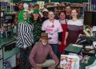 (Above): Stewart’s Food Store co-owner Robert Stewart poses with employees at the store founded by his parents, Harold and Faye Stewart. Robert Stewart runs Olney’s only grocery store with his brother, Danny, and son-in-law Jason Pack. Olney residents
