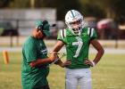 Bobcat Head Football Coach and Athletic Director Isaiah Archer go over plays on the side during the preseason scrimmage. Photo by Will Sadler