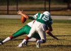 A Bobcat forces a fumble against the May Tiger quarterback. Photo by Will Sadler