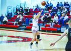 OHS Lady Cub #4 Mackenzie Berngen launches a bomb from outside the line for 3. Photo by Will Sadler