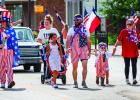 The Refuge Olney Christian Community Center director Rodney Nance, (far left) dressed as Uncle Sam, parades down Main Street with his family on July 4 after winning Most Patriotic Citizen for the third year in a row. See Pages 8 and 10 for and more photos