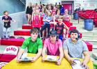 OHS Student Athletes head up the student cheering session with their own sports analyst and sportscaster table. [L-R] Kyle Stewart, Kanton Rodgers and Ricco Sandoval. Photo by Will Sadler