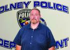 Olney’s new police chief, Bryan Barrett, started work on Monday, after spending the weekend moving into his new office at the OPD. Photo by Will Sadler