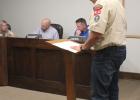 American Legion District Commander and Olney Scout Leader Chris Garcia addresses the City Council on plans for the scout hut. Photo by Gina Keating