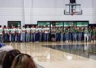 Bobcat football players, Ladycat volleyball players, and cheerleaders line up in the gym preparing to take the traditional walk through the Bobcat blowup. Photo by Will Sadler