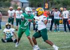 OHS Bobcat #0 Tristan Schultz RB/DE plows through the Jaguar line, leaving #20 Jaguar defender lying on the ground, wondering what the number of the bus that ran over him was. The Bobcat defense was too much for the Guthrie offense, leading to a 50-0 blow