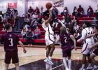 OHS Cubs #4 Jamarcus Collins put up 6 points for the Cubs with a combination of floaters and drives to the basket. Shown making a bucket inside the line with a floater. Photo by Will Sadler