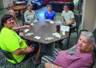 Cub Center guests enjoying a game of Chicken Foot pause to mark the occasion during the Cub Center June Game Night. Photo by Will Sadler