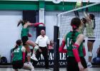 Ladycat #20 Kenzie King slams a kill shot between two Lady Pirate defenders at the net. Photo by Will Sadler