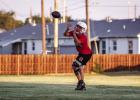 A Cub receiver practices running routes and catching. Photo by Will Sadler